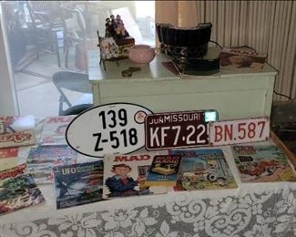 Vintage European and Missouri license plates, comics including Mad Magazine
