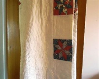 a large collection of quilts
