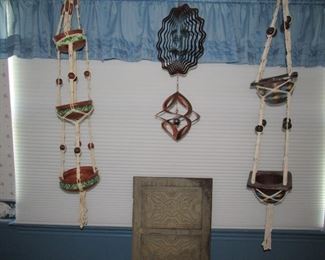 A pair of vintage heavy pottery hanging baskets