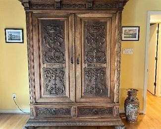 gorgeous carved antique two door cabinet ( can be used to store TV, electronics or clothing) BRING HELP TO MOVE THIS ITEM