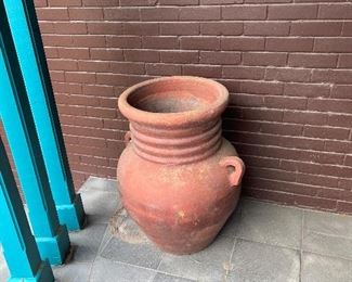 large pots, olive jars, patio furniture out back
