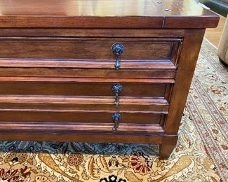 Safavieh American Home Map Coffee Table - Cherry Finish.  53 1/4” wide x 35” Deep x 20” High. Lots of storage includes two drawers, top drawer 2” high great for remotes, DVD’s, lower deep drawer is a 6” high and great for throw blankets, pillows, etc.