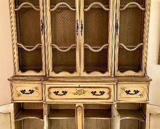 Vintage Stunning  2pc China/Display Hutch by Saginaw Furniture with Wire Mesh on doors and painted in a buttery antique paint (original) with Floral Stencils on Doors and Drawers.  This piece morphs into a secretary, as the center opens out into a desk,  Super impressive Piece from the 1960's Amazing storage too!