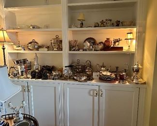 Collection of collectables and silver plate serving pieces. 