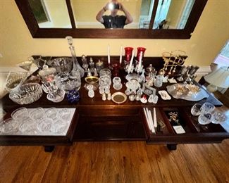 Lots of cut glass, candlesticks and serving pieces. 