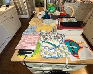 Collection of kitchen linens and potholes. 