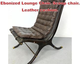 Lot 147 Decorator Cane and Ebonized Lounge Chair. Scoop chair. Leather cushion. 