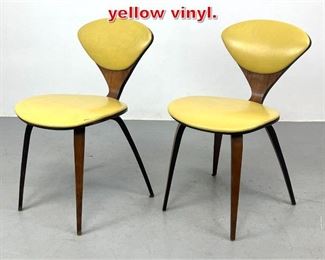 Lot 148 Pair Cherner Chairs with yellow vinyl. 