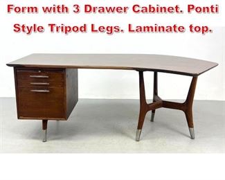 Lot 251 Modernist Desk. Curved Form with 3 Drawer Cabinet. Ponti Style Tripod Legs. Laminate top. 
