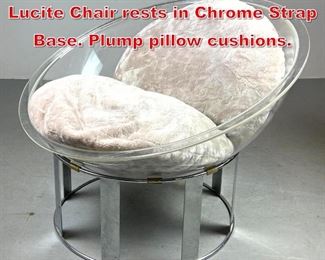 Lot 259 1960s Half Bubble Clear Lucite Chair rests in Chrome Strap Base. Plump pillow cushions. 