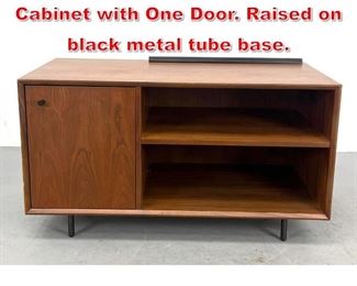 Lot 276 Mid Century Modern Cabinet with One Door. Raised on black metal tube base. 