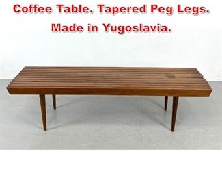 Lot 345 Modernist Slat Bench Coffee Table. Tapered Peg Legs. Made in Yugoslavia. 