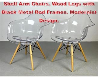 Lot 384 Pr Eames style Molded Shell Arm Chairs. Wood Legs with Black Metal Rod Frames. Modernist Design. 