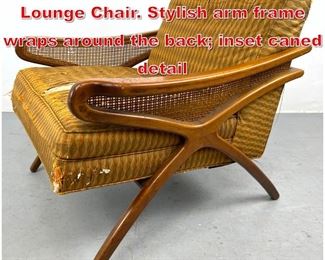 Lot 401 Elegant Italian style Wood Lounge Chair. Stylish arm frame wraps around the back inset caned detail