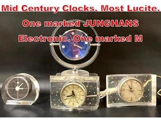 Lot 491 Collection 4 Modernist Mid Century Clocks. Most Lucite. One marked JUNGHANS Electronic. One marked M