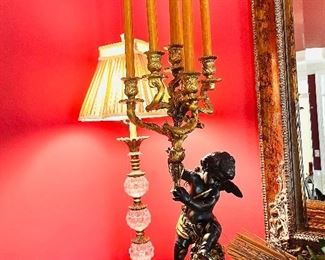 Pair of gilt painted wood cherub candle holders