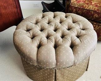 Upholstered tufted ottoman on casters