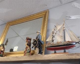 nautical items and large ornate gold mirror