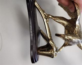 large brass eagle on wood base