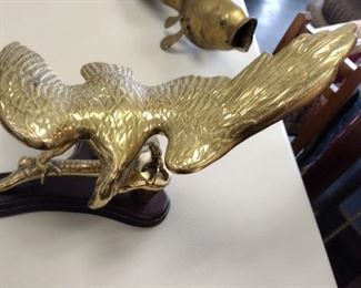 large brass eagle on wood base