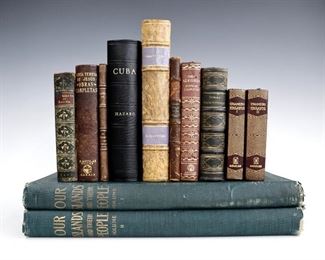 Twelve 19th and 20th century books.  Includes Olivares, Jose de "Our Islands and their People as Seen with Camera and Pencil" (Vol I & II) 1899; Hazard, Samuel "Cuba with Pen and Pencil" 1871; Thackeray, W.M. "Punch's Prize Novelists" 1853; Bacon, Francis "The Essays of Francis Bacon" 1903; Vera Zuniga Y Figueroa, Juan Antonio de "El Exbaxador" 1947; Ortega y Gasset, Jose "Espana Invertebrada" 1922; Alegria, Ciro "Novelas Completas" 1963; Unamuno, Miguel de "Ensayos" (Vol I & II) 1967; and Gazenave, Dr. A "El Tesoro de las Familias" c. 1900.  Various bindings and sizes (up to 16" high).  Some wear and losses, pages with toning and foxing.  ESTIMATE $40-60