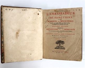 Wicquefort, Abraham.  "L'Ambassaduer et ses Fonctions" Volumes I & II.  Cologne; Pierre Marteau, MDCCXV (1715).  Full speckled calf with raised bands and sprinkled edges, 4to (10" high).  Wear and damage, splitting at spines, pages with toning and foxing.  ESTIMATE $20-40