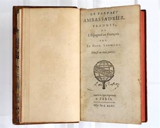 Vera Zuniga Y Figueroa, Juan Antonio de.  "Le Parfait Ambassadeur" translated to French by Nicolas Lancelot.  Paris; 1642.  Older rebinding, leatherbound, laid paper.  Full paneled calf with raised bands and painted edges, 32mo (5" high).  Some wear and splitting at spine, pages with toning and minor foxing, handwritten notes.  ESTIMATE $20-40