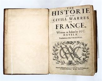 Davila, Arrigo (Enrico) Caterino.  "The Historie of the Civill Warres of France" bound with "The Continuation and Conclusion of the Civill Warres of France" First English Edition.  London; R. Raworth, MDCXLVII (1647).  Full mottled calf with raised bands, 4to (12 1/2" high).  Some wear and damage, split at spine, pages with toning and some foxing, book plates, catalog stamp at edge.  ESTIMATE $40-60
