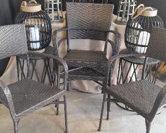 Four Patio Chairs with Three Tables Some Candle Light Fixtures