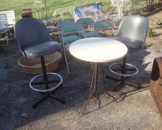 Round table with wrought iron base