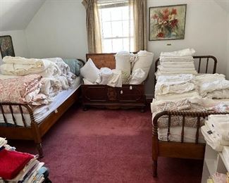 spindle twin beds, hope chest and lots of bedding