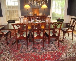 Antique dining table with extra horizontal supports 