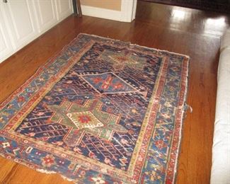Tattered hand tied rug