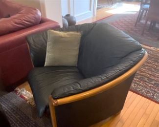 Teakwood and leather chair.  Hand made rugs