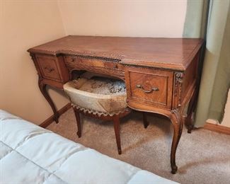 There is a mirror that can hang on the wall above this