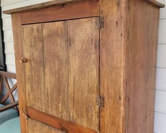 Primitive Pine cabinet on screened porch