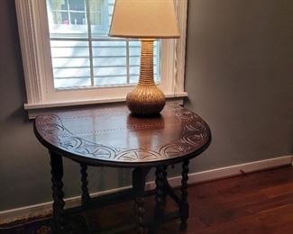 Carved drop leaf table