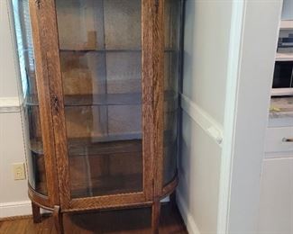 vintage Bow Glass front china cabinet with wooden shelves