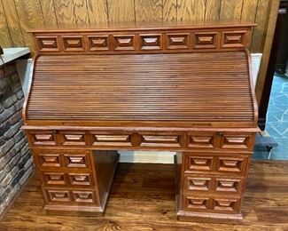 Real Wood Roll Top Desk.  In person pick up only. 
Dimensions: 56"L x 26.5"W x 51"H.                                                  $400 or Best Offer. 