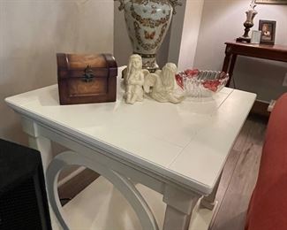 decorative box, angel figurines, one of a pair of white end tables