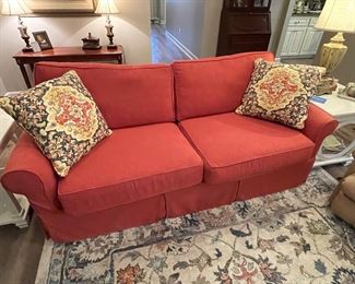 like new, coral colored Riverside sofa