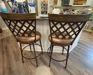 pair of metal swivel bar height stools
