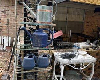 bakers racks, watering cans, tons of out door décor 