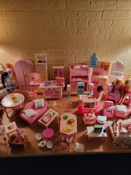 Looking to sell all of this barbie furniture and a few dolls as a package 200.00 obo.