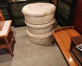 Three 70s ottomans