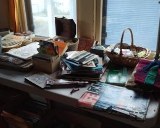 Ephemera--artwork, post cards, book marks, maps, pin back buttons, hand made weavings, scarves.