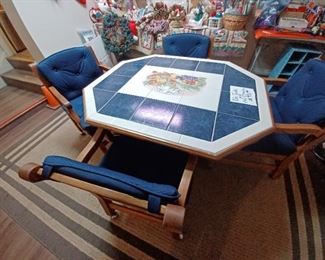 Super fire tile table w/ fruit motif and 4 rolling oak chairs with blue fabric pads