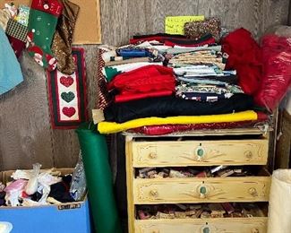 Fabric and a dresser of scrapbooking stamps