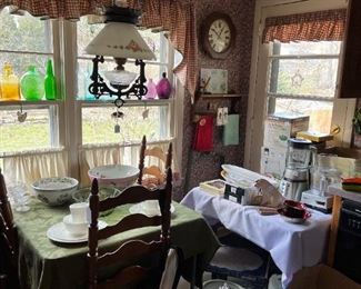 Hanging iron lamp with painted glass shade $75