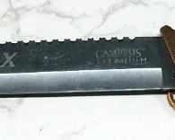 Camillus Carnivore X Titanium Knife With Serrated Back Edge, 11.5" Blade, In Sheath
